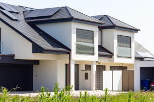 Modern duplex with solar panels and contemporary design in a suburban neighbourhood