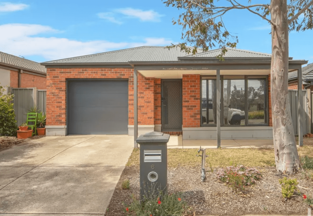 Brick single-storey investment home in Kurunjang, Vic 3337 with a grey Colorbond roof, single garage, front porch and low-maintenance front yard.