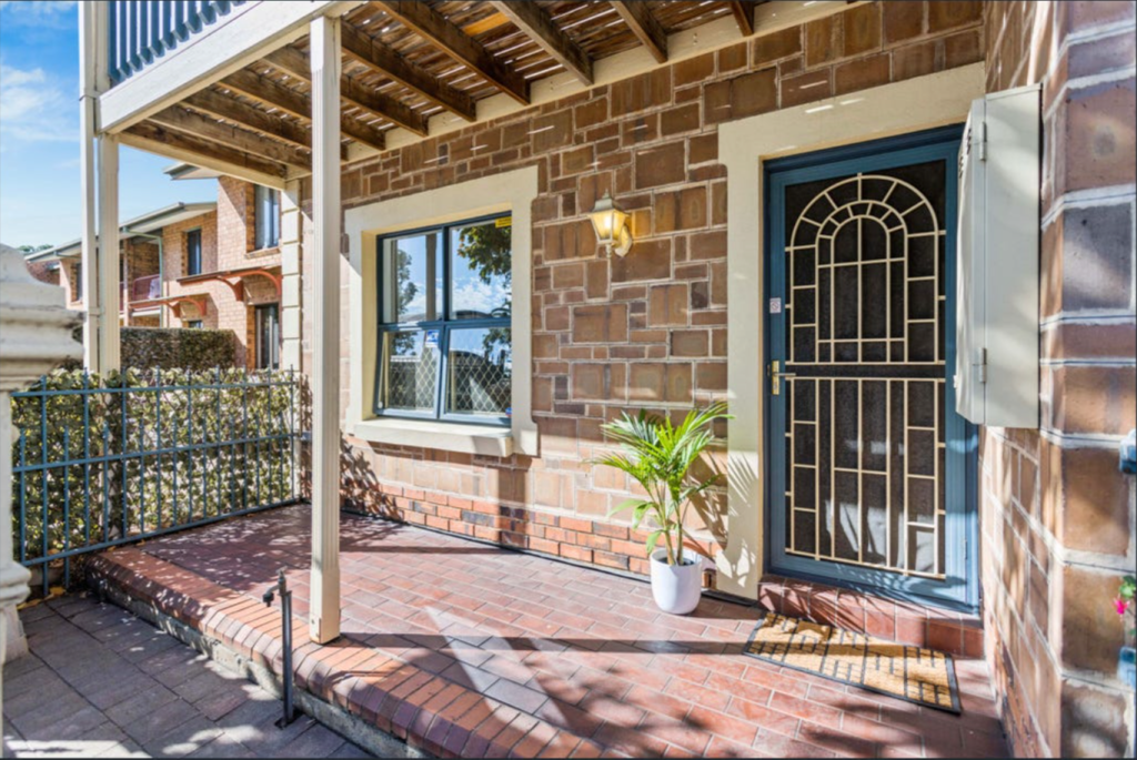 Heritage sandstone home with secure entry and pergola — pro bono placement secured by 28th Street Agency, Alberton SA